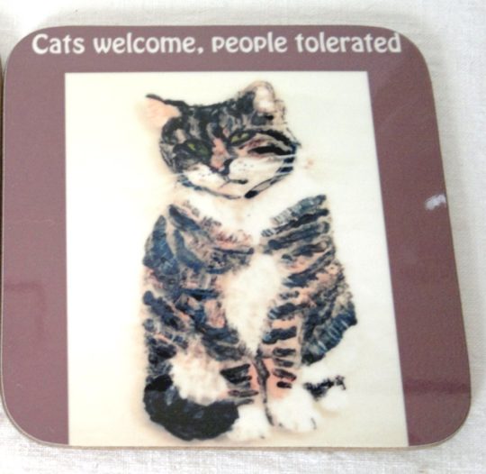 Tabby cat with text Cats Welcome, People Tolerated