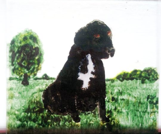Pet portrait glass painting of a black labrador on a glass coaster
