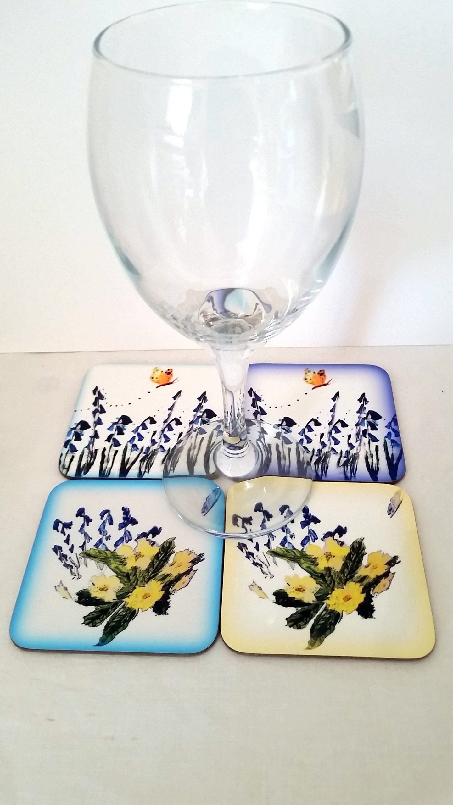 Coaster set with bluebells, primroses and butterfly