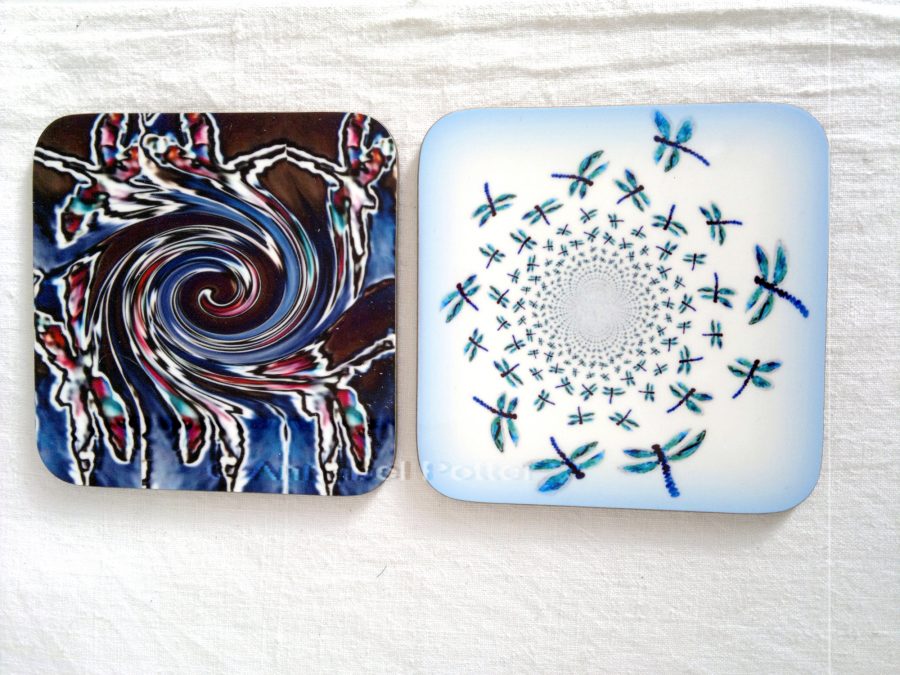 Two coasters with abstract dragonfly illustrations