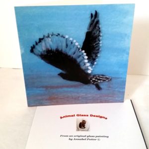 Greeting card with an owl flying at sunrise