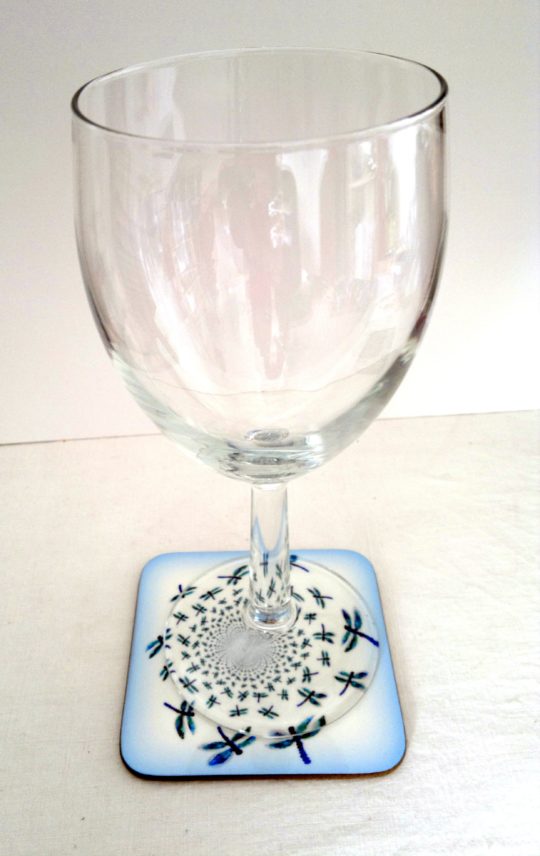 Coaster photo with abstract dragonflies and a wine glass