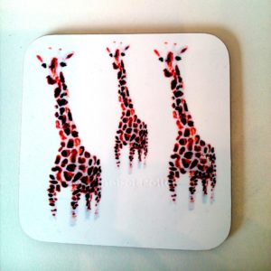 Coaster with an illustration of three giraffe