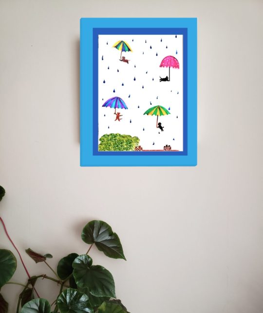Wall art with a fun A4 print of cats, dogs and umbrellas in the sky with raindrops
