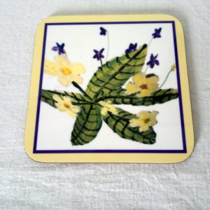 Floral drinks coaster with violets and primroses