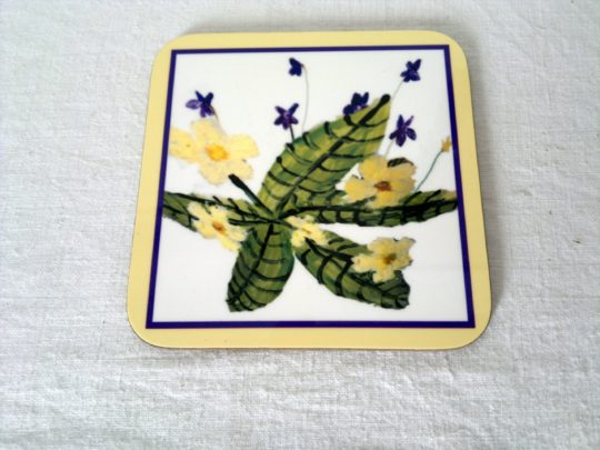Floral drinks coaster with violets and primroses