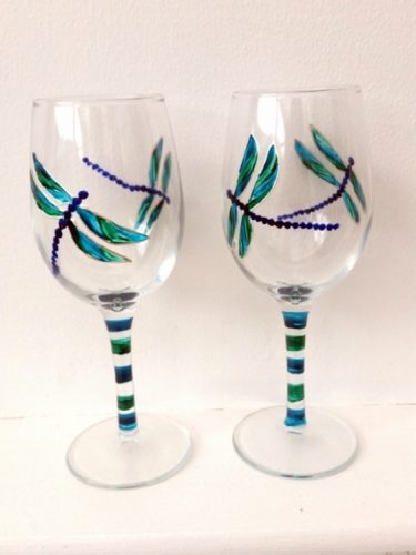 A pair of dragonfly wine glasses, hand painted
