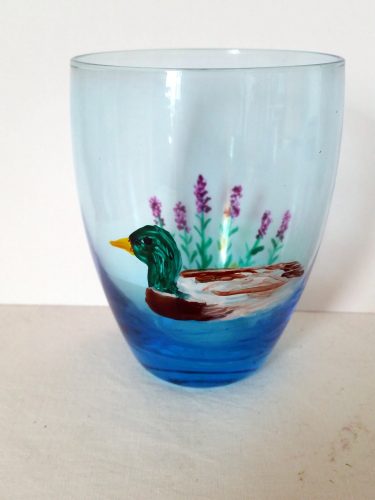 Duck glass painting on a blue glass