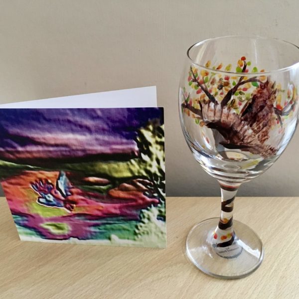 Owl wine glass photographed with an abstract owl card