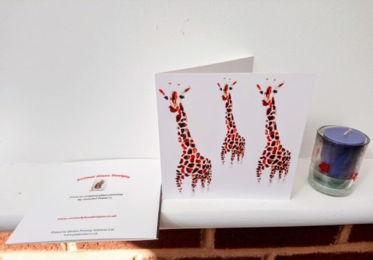 Wildlife greeting ard with three giraffe