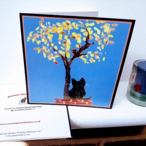Greeting card with a cat sitting on a wall under a tree with Autumn leaves