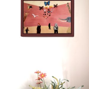 Wall art of animals at a museum and people in the foreground