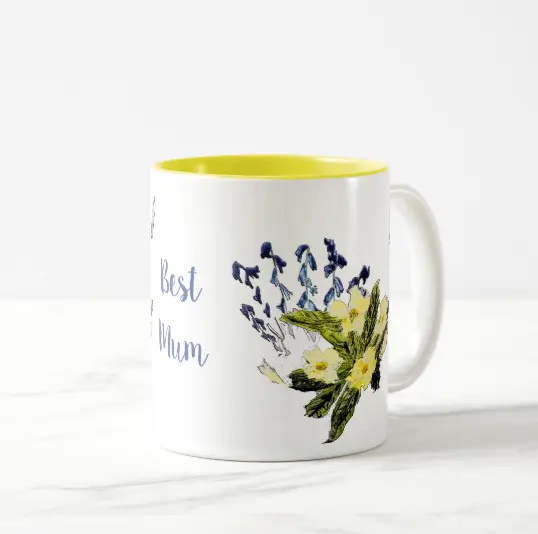 Floral mug with primroses, bluebells, butterfly and the text 'best mum'